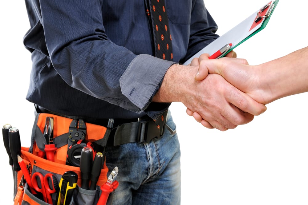 Technician shaking hands with happy customer